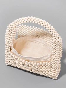 Handcrafted cream wooden bead shoulder bag with canvas drawstring lining and retro design
