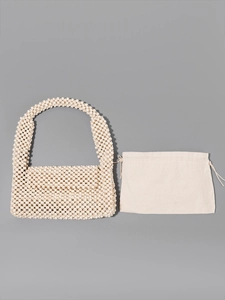 Handmade cream beaded shoulder bag with minimalist canvas drawstring inner pouch