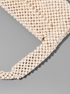 Handmade cream beaded handbag for women featuring a woven texture and round wood beads