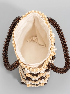 Handmade beaded tote bag with brown and beige wooden beads and drawstring canvas lining