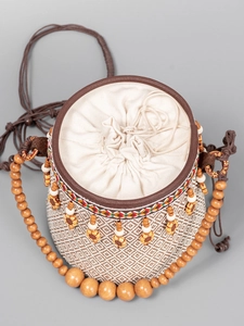 Bohemian woven bucket bag with sunflower wooden charms and bead strap for beach vacations