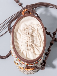 Ethnic straw bucket bag with pearl charms, wooden beads and inner drawstring liner