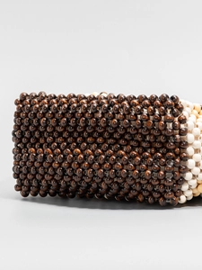 Handmade woven oversized wooden bead handbag for beach vacation in dark brown and beige