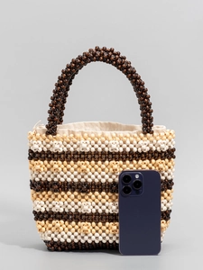 Handmade beaded handbag with wooden beads in beige and brown, includes smartphone for size