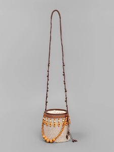 Ethnic straw bucket bag with geometric patterns and yellow beads for beach vacations