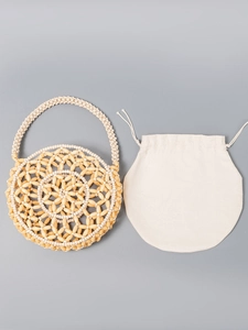Handmade beaded round handbag with floral pattern and removable cotton drawstring pouch