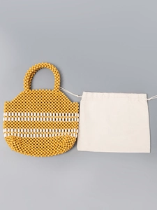 Handmade yellow and white beaded handbag with wooden beads and a drawstring dust bag