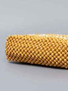 Handmade woven wooden bead handbag with yellow and white floral cylinder design