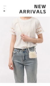 Crossbody view of a handmade pearl beaded square bag with high luster finish