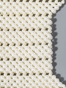 Élégant sac à bandoulière en perles d'ivoire avec texture perlée artisanale et fini brillant