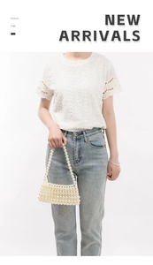 Detailed view of handmade woven pearl shoulder bag with vintage beaded texture