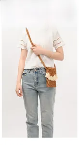 Handmade mini wooden bead crossbody bag with bohemian beige tassel and bead strap detail