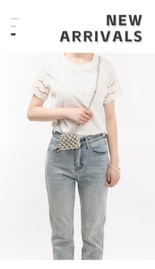 Detail of a shiny silver beaded mini crossbody bag styled with a summer outfit