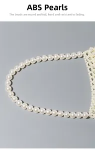 Detailed view of the intricate hand-woven white ABS pearls on a stylish tote bag