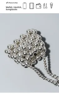 Silver bead bag detail showing capacity for iPhone, wallet, lipstick and sunglasses