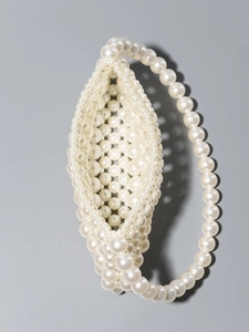 Handmade pearl beaded shoulder bag for beach vacation with circular ring top handle