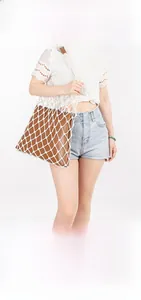 Detail of hand-woven cotton net bag with brown leather inner pouch and white shoulder straps