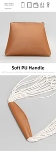 Detail view of the brown PU tote bag showing soft handles and daily storage capacity