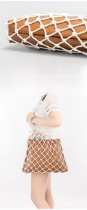 Detail of the white cotton woven mesh overlay on brown leather tote bag