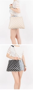 Detail of dual-layer woven mesh tote bag with inner zipper pouch for beach vacations