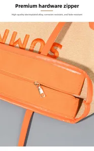 Dettaglio della cerniera dorata di alta qualità sulla borsa da spiaggia in tela arancione