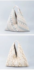 Detail of triangle canvas tote bags showing geometric patterns and woven texture