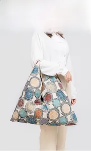 Detailed shot of large capacity canvas hobo bag with colorful concentric circle patterns