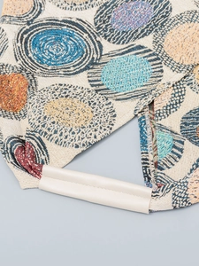Chic jacquard canvas underarm bag featuring colorful swirl patterns and leather handle
