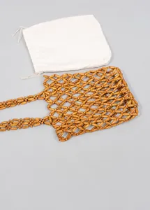 Detail of handmade woven wooden bead bag featuring an oval mesh design and inner pouch