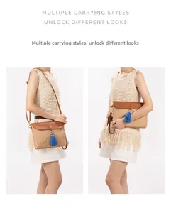 Detail of straw woven crossbody bag with brown leather flap and blue tassel accent