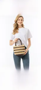 Detail view of handmade beaded handbag with colorful horizontal stripes and wood bead handle