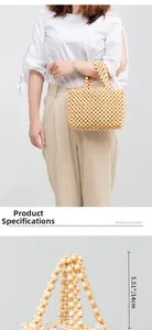 Detail view of woven beaded handbag with 14cm handle height measurement and wooden bead texture
