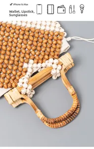 Close-up of bamboo handle and woven wood beads showing space for phone and wallet