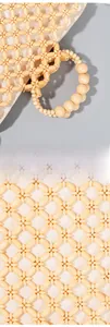 Detailed macro view of handcrafted wooden bead weaving and round handle design on handbag