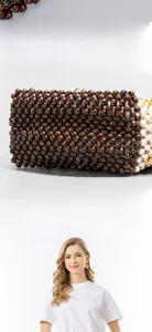 Detail of handmade beaded handbag showing intricate weave pattern and firm structure