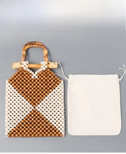 Detail of beaded handbag with detachable cotton drawstring liner and bamboo handles