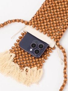 Bohemian wood bead woven crossbody bag with cream canvas drawstring lining and long tassels