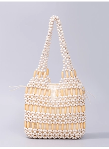 Detail of maple wood bead woven tote bag with white round beads and drawstring liner