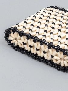 Chic woven beaded crossbody bag with white and black geometric pattern and lining