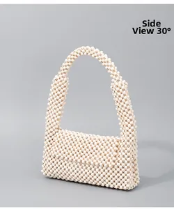 Ivory hand-woven beaded shoulder bag shown from a 30-degree side profile angle