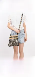 Detail of hand-woven beaded shoulder bag showing intricate hollow grid pattern and wood beads