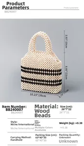 Detail view of handmade woven wooden bead handbag showing 26x7x22cm dimensions and design