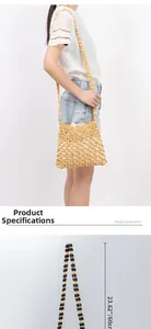 Detail view of yellow woven bead bag showing shoulder strap length of 23.62 inches or 60cm