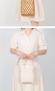 Detailed close-up of handmade wooden bead bags in white and natural wood tones