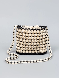 Chic woven beaded crossbody bucket bag with black diamond pattern and canvas drawstring inner
