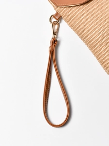 Straw beach bag with brown leather strap and gold metal hook for women's seaside vacation