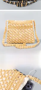 Detail showing hand-woven wood beads texture and white cotton linen lining of the square bag