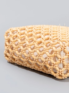 Handmade woven tote bag featuring natural wooden beads and a canvas liner for summer