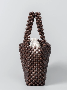 Handmade brown wood bead bucket bag with creamy white drawstring liner for women
