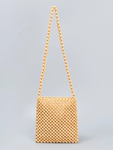 Handmade woven crossbody bag crafted with natural wooden beads and a fabric lining